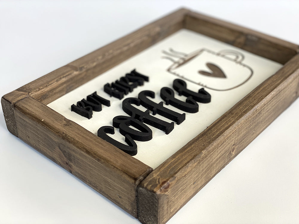 closeup of but first coffee wood sign