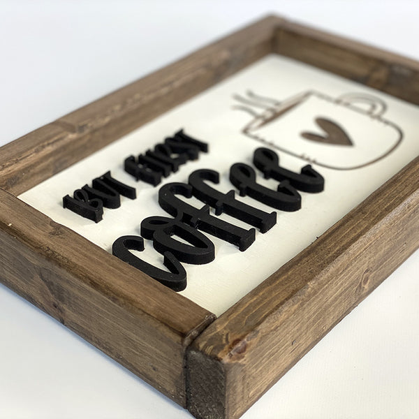 closeup of but first coffee wood sign