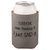 Gray can cooler with humorous text and white can inside on a white background