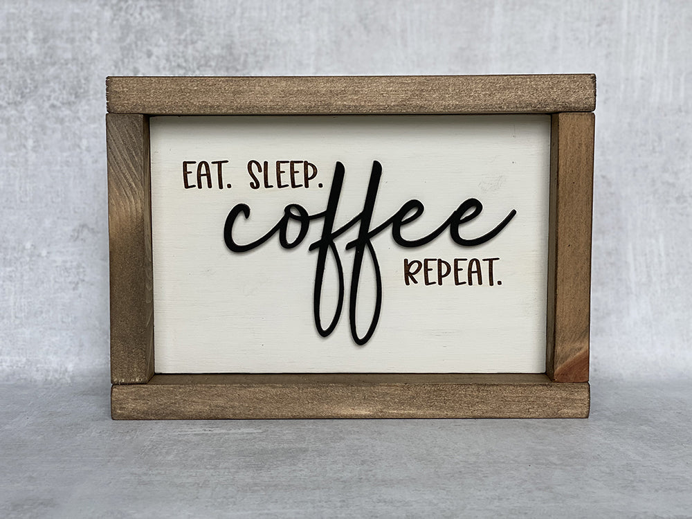 Eat sleep coffee repeat wood sign on gray background