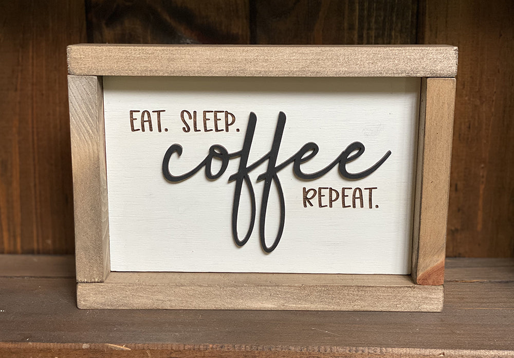 Eat sleep coffee repeat wood sign on wood shelf