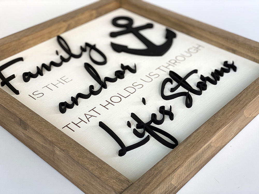 close up of Family is the anchor through life's storms wood sign