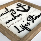 close up of Family is the anchor through life's storms wood sign