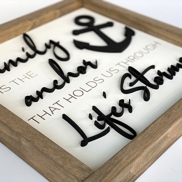 close up of Family is the anchor through life's storms wood sign