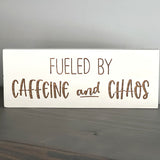 Fueled by caffeine and chaos wood sign on gray shelf