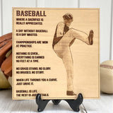 Wooden plaque engraved with a baseball player photo and text on a stand.
