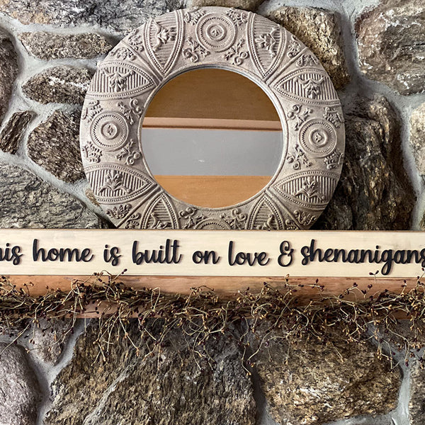 This home is built on love & shenanigans wood sign