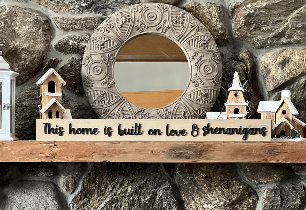 Mantle with mirror and wood sign