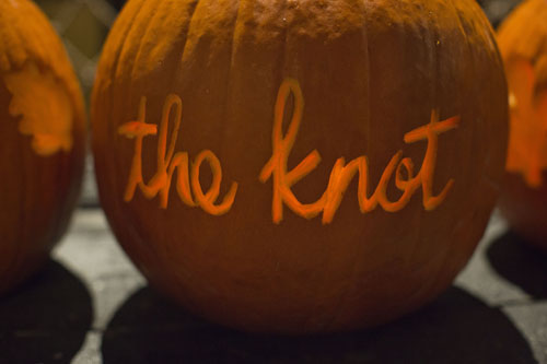 Carved pumpkin with The Knot's logo for their Marketing Mixer at Boston Tea Party Ships & Museum.  Pumpkin by SKO Designs. Photo courtesy of Carly Michelle Photography.
