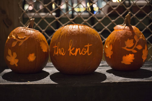 Carved pumpkin with The Knot's logo for their Marketing Mixer at Boston Tea Party Ships & Museum.  Pumpkin by SKO Designs. Photo courtesy of Carly Michelle Photography.