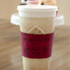 Red cork fabric cup sleeve I'm a simple woman mug baseball flip flops with cupcakes in the background