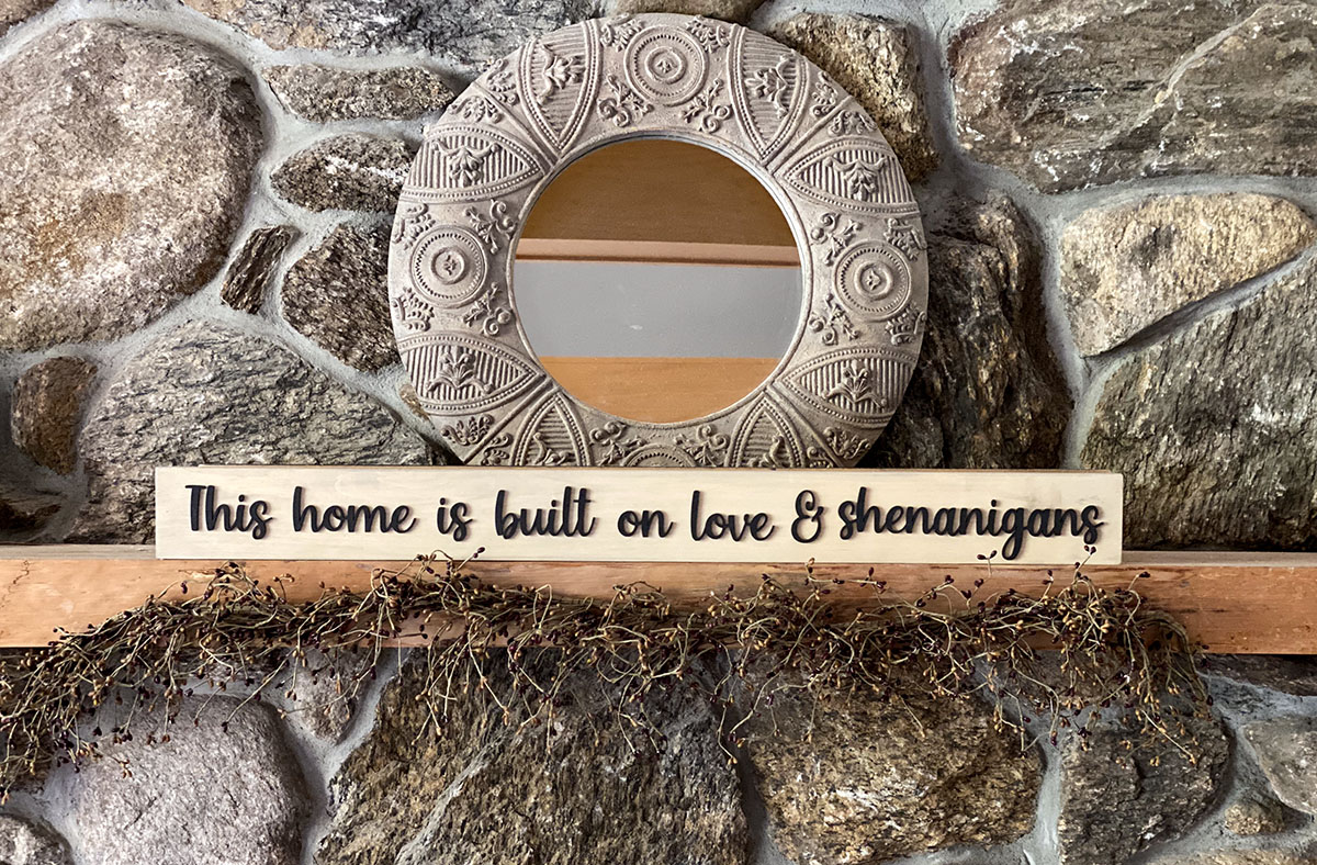 This home is built on love & shenanigans wood sign