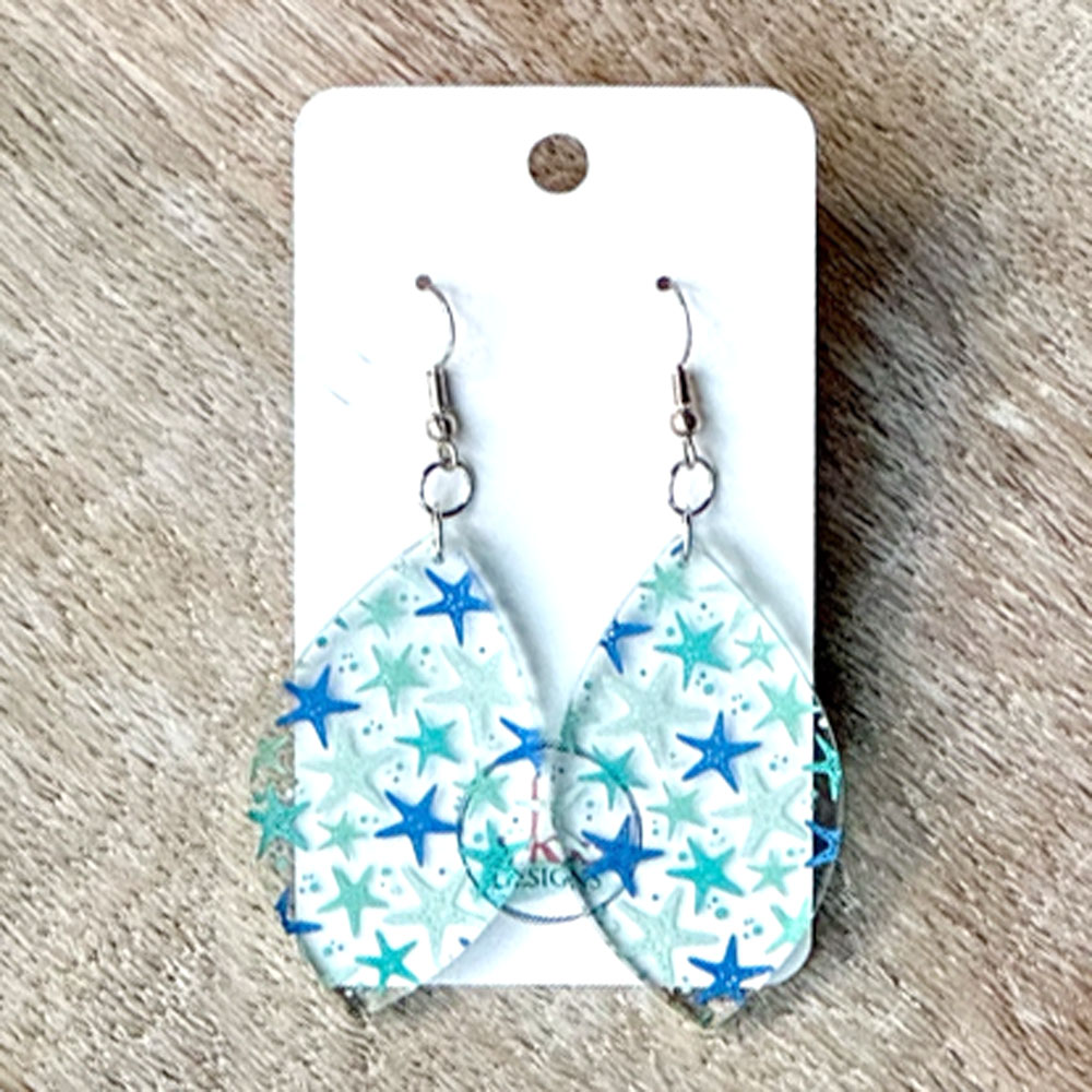 Closeup of Scattered Starfish Acrylic Earrings